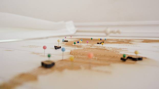 A series of coloured pins show a journey from through South America into the Northern Hemisphere.