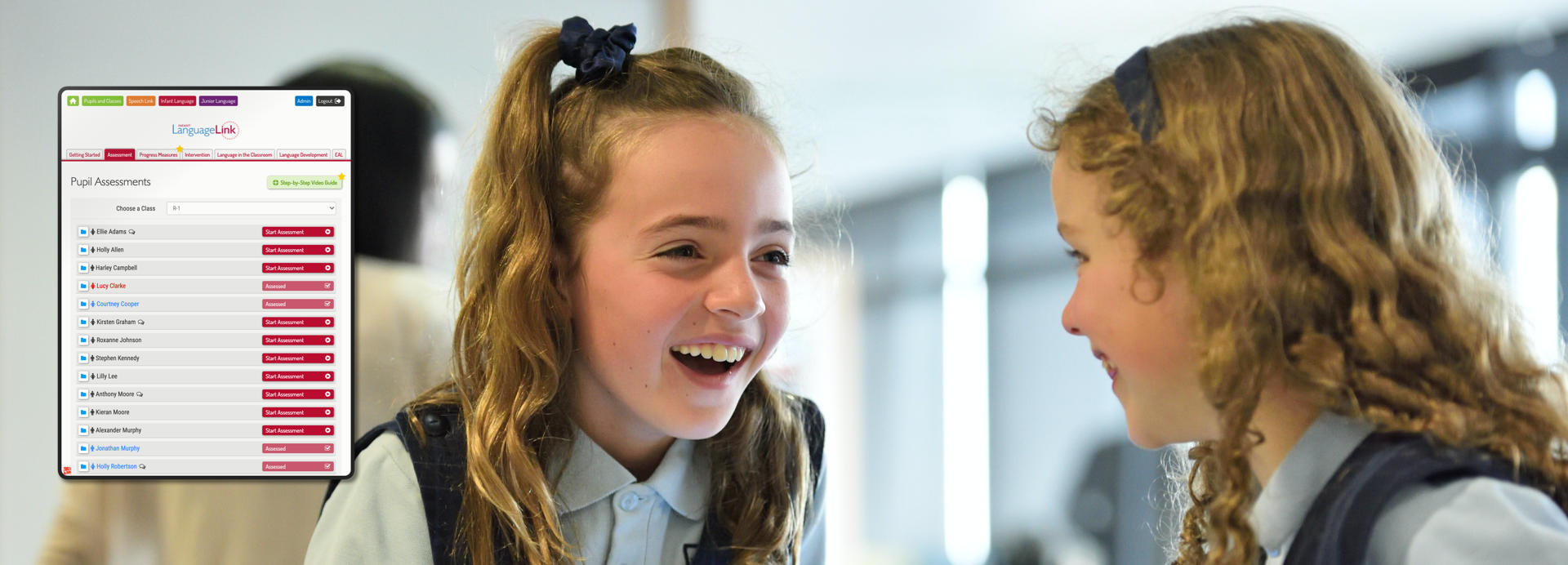 Two young girls take part in a speech therapy session. A tablet at the left of the photo shows the Speech Link web interface.